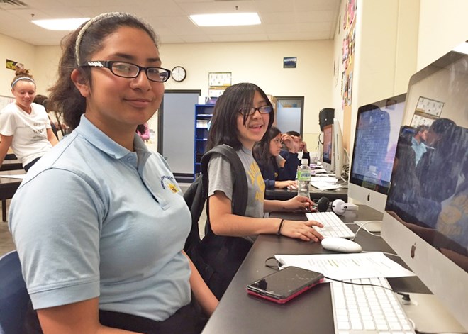Catherine Gonzalez, 14, and teammate Deysi Sanisaca, 13, worked on a Technovation team that developed an app called “Piggy Saver.” - Annie Baxter/Marketplace